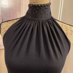 Cotton top with high neck beading decor.